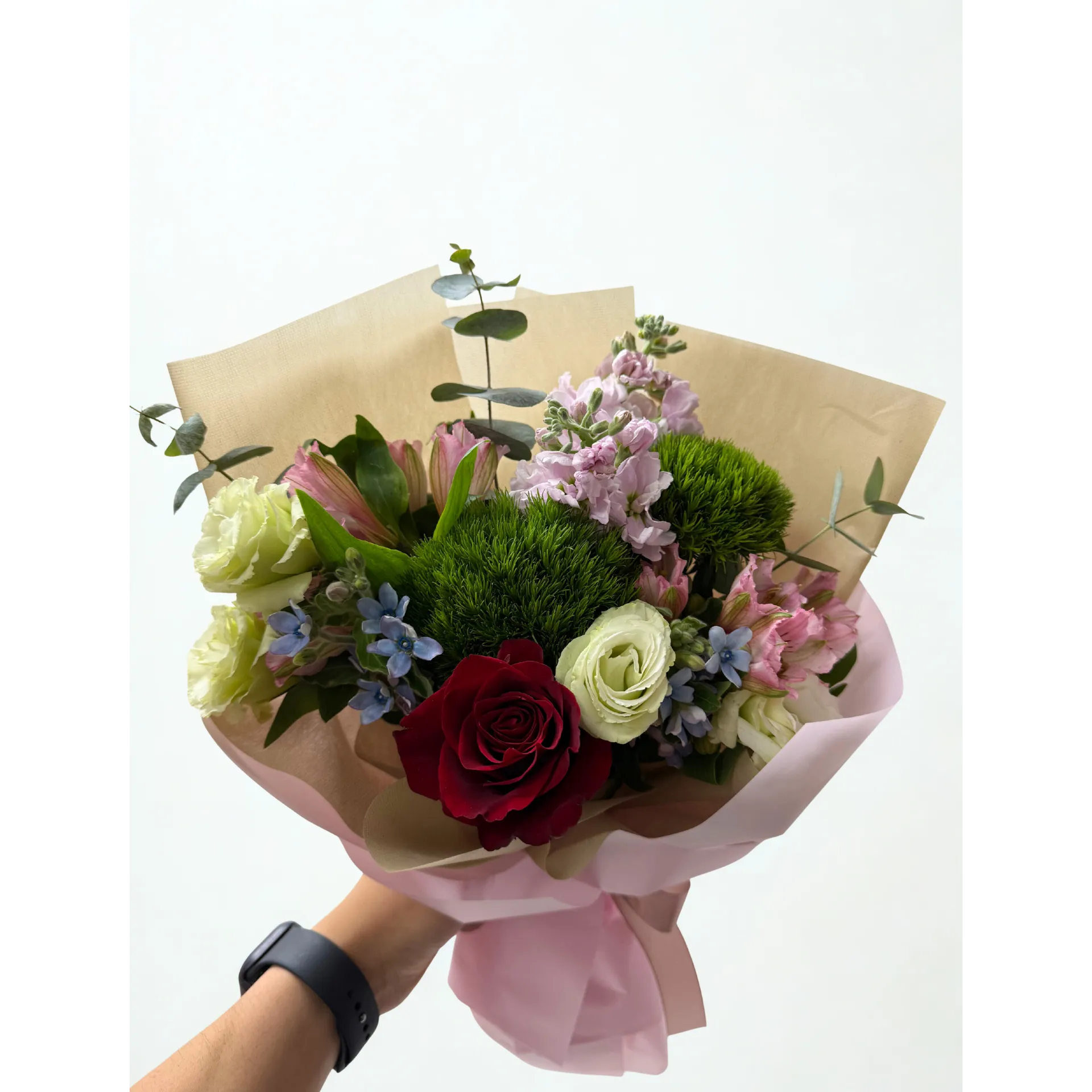 Beautiful bouquet with white lilies, pink peonies, green roses and purple accents