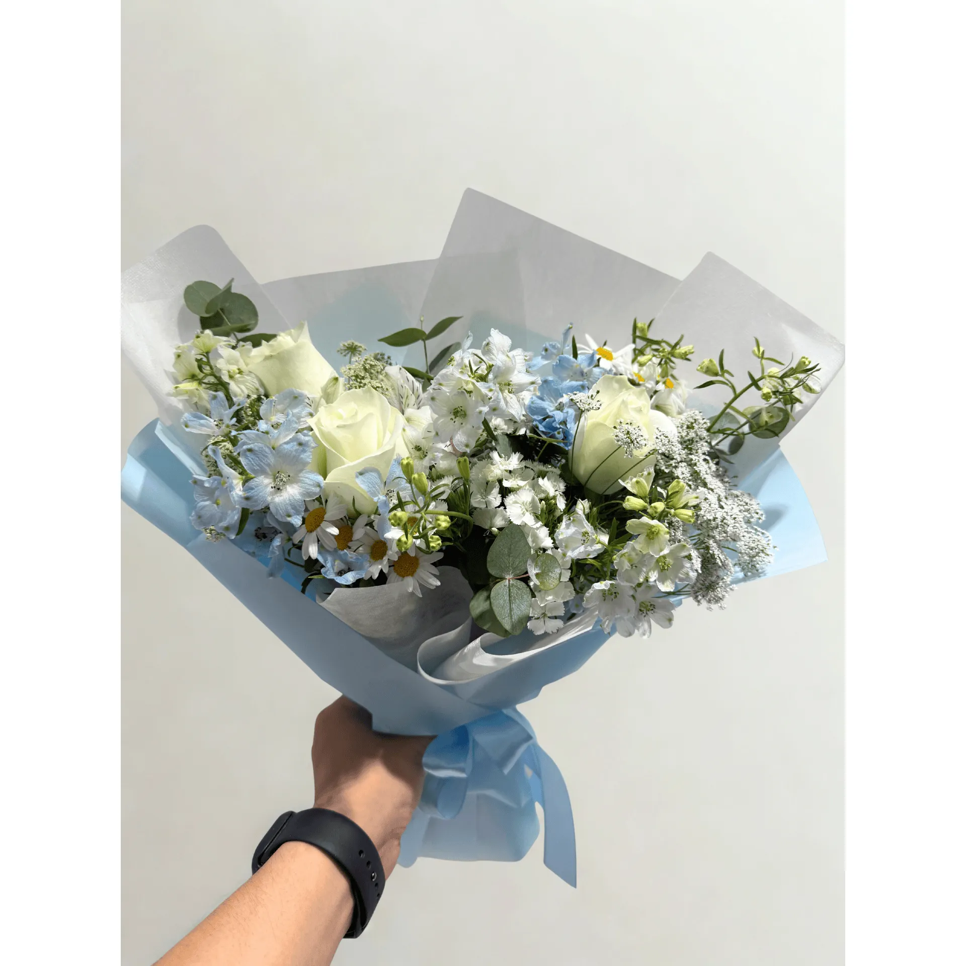 Elegant bouquet with roses, hydrangeas and seasonal blooms in pastel colors